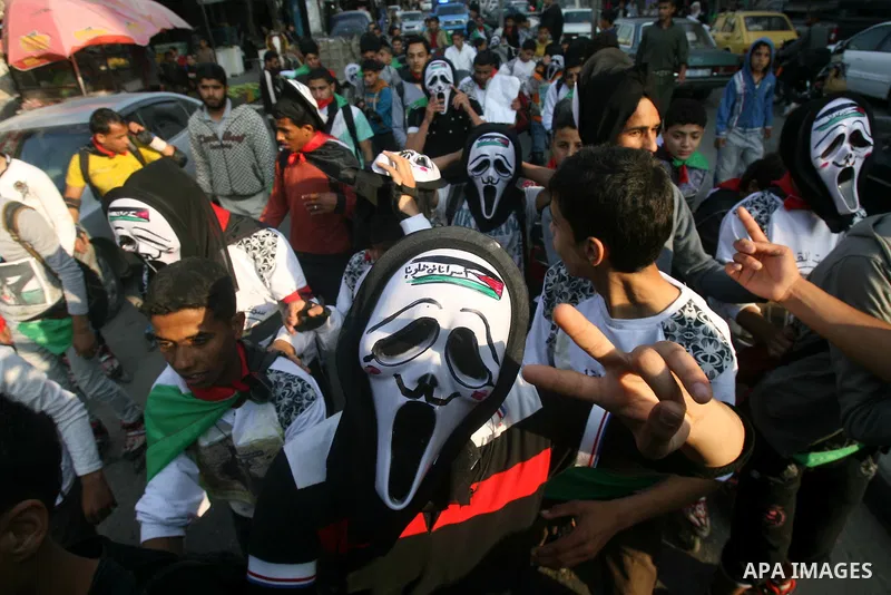 Members of Palestinian youth skate team wear ghost face's masks as they take part in a rally to show solidarity with Palestinian prisoners inside Israeli jails, ahead of Palestinian prisoner's day in south of Gaza strip...