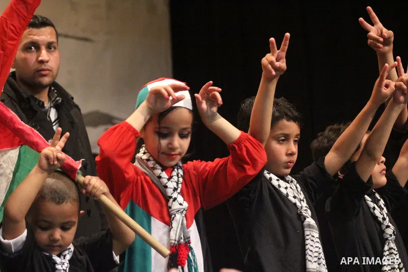Palestinian artists perform during a ceremony organized by Islamic Jihad movement, to show solidarity with Palestinian prisoners inside Israeli jails, ahead of Palestinian prisoner's day in Gaza city on April 16, 2013. P...