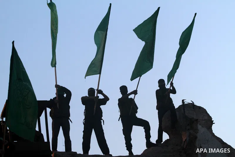 Palestinian masked youths take part in the opening ceremony to announce the start events of Palestinian Prisoner's Day, in Gaza city on 16, 2013. The Palestinian Prisoner Club said in a report that as of 2013 there were...
