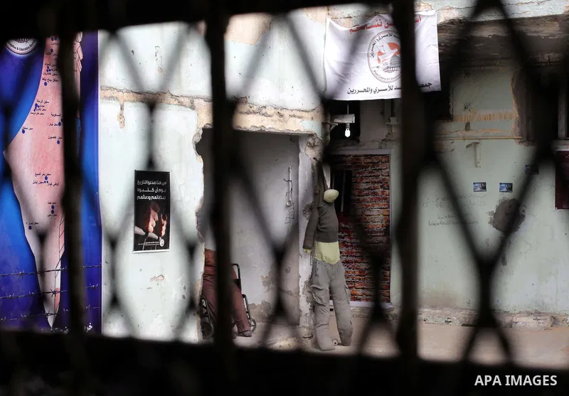 Dummies of Palestinian prisoners and posters hang on the wall of the Saraya prison that was formerly used by Israeli security, in central Gaza City, Gaza Strip, 17 April 2013. The facility has now been turned into a memo...