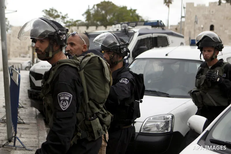 Israeli security forces arrest a Palestinian man during a demonstration to mark the Prisoners' Day outside Damascus gate, in the old city of Jerusalem on April 17, 2013. Palestinians across the territories are attending...