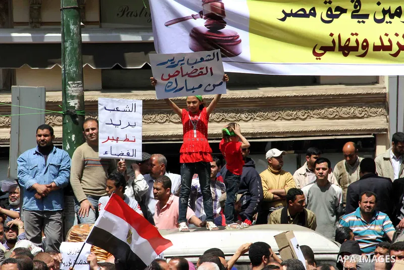 Supporters of Egyptian Muslim Brotherhood President Mohamed Morsi protest in front of the High Court in Cairo demanding a purge in the Egyptian judicial system on April 19, 2013. Photo by Tareq Gabas