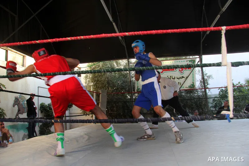 Palestinian boxers fight during the championship of "Loyalty to Palestinian Prisoners" in Gaza city on April 19, 2013. Some of 34 Palestinian boxers participated in championship organised by the Palestinian Federation of...