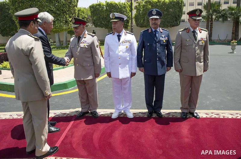 U.S. Defense Secretary Chuck Hagel (2nd L) walks with Egyptian Defence Minister General Abdel Fattah Sisi during an arrival ceremony at the Ministry of Defence in Cairo April 24, 2013. Photo by Tareq Gabas
