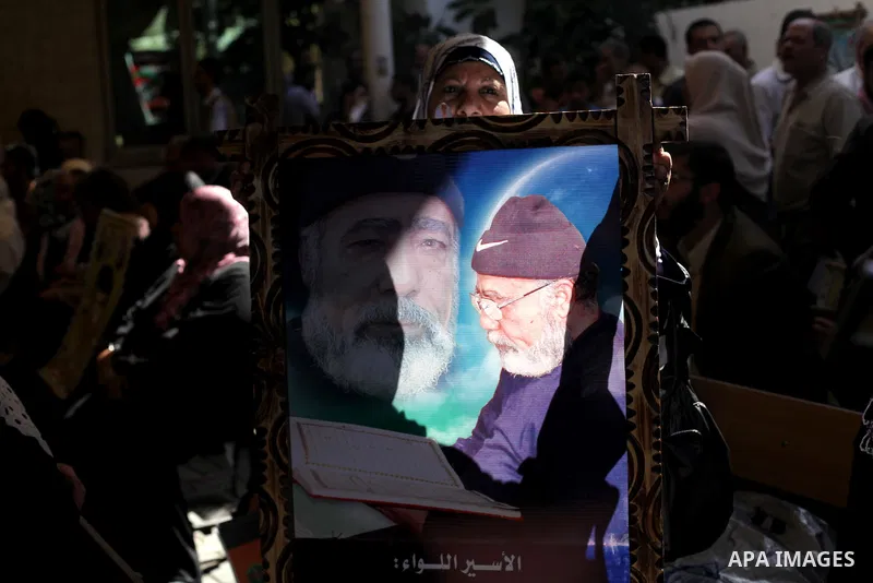 Palestinian women hold pictures of prisoners held in Israeli jails during a protest in front of the Red Cross offices in Gaza city, on Apr. 29, 2013 in solidarity with Palestinian prisoners held by Israel to demand their...