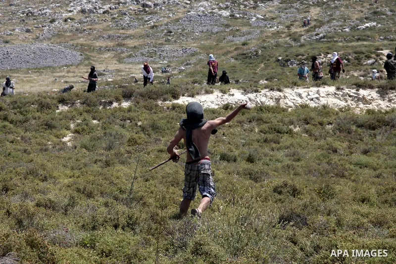 Palestinian villagers from Oref village clash with Jewish settlers after Israeli settlers attacked villages near Nablus City 30 April 2013. Reports state that the clashes occured after an Israeli settler was stabbed to d...
