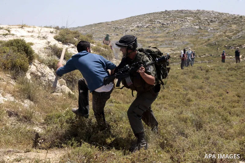 Israeli border police arrest a Palestinian villager from Oref village during clashes with Jewish settlers after Israeli settlers attacked villages near Nablus City 30 April 2013. Reports state that the clashes occured af...