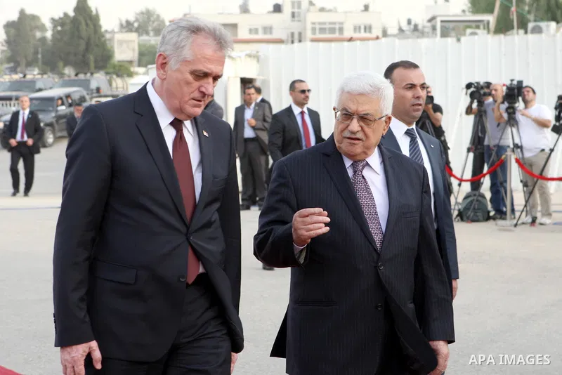 Palestinian President Mahmoud Abbas speaks with Serbian President Tomislav Nikolic upon his arrival for their meeting in the West Bank city of Ramallah May 1, 2013. Photo by Thaer Ganaim