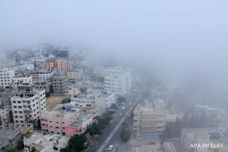 A view taken from Gaza city shows a heavy fog of hazy arrives over Gaza strip from the west on May 02, 2013. Photo by Hossam Salem