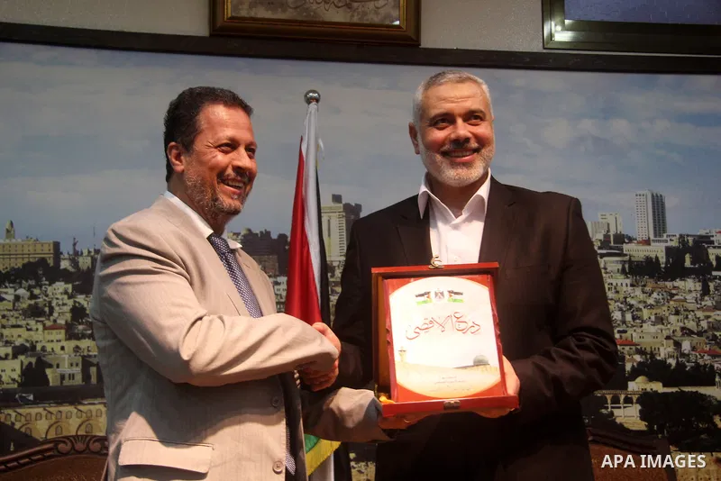 Palestinian Prime Minister in Gaza strip Ismail Haniyeh meets with members of "al-Wafaa convoy" which includes activists from Turkey, Tunisia, Egypt and Europe, in Gaza city on May 02, 2013. Haniyeh emphatically rejected...