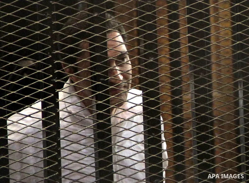 Alaa and Jamal Mubarak, sons of ousted Egyptian President Hosni Mubarak, appear in the dock inside the court over charges of corruption in a housing project for pilots in Cairo, Egypt, on May 04, 2013. The session was de...
