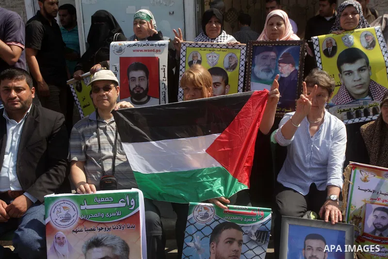 Delegation of the Swiss take part a protest in front of the Red Cross offices in Gaza city, on May. 06, 2013 in solidarity with Palestinian prisoners held by Israel to demand their release from detention without trial. P...
