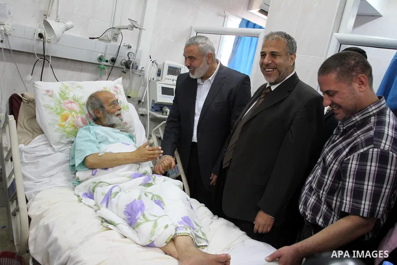 Palestinian Prime Minister in Gaza strip, Ismail Haniyeh visits Abdel Aziz Shahin leader of the Fatah at Al-Quds hospital in Gaza City on May 7, 2013. Shahin entered the hospital after his health deteriorated. Photo by M...