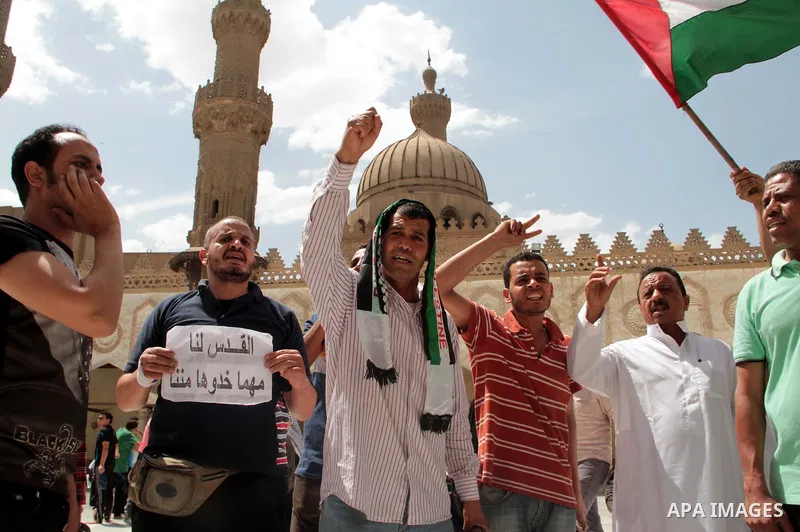 Egyptian protesters take part in a demonstration in support of the Palestinian people and of Muslims around the world, on May 10, 2013 in front of the Al-Ahzar mosque in Cairo. Protesters gathered to condemn recent Israe...