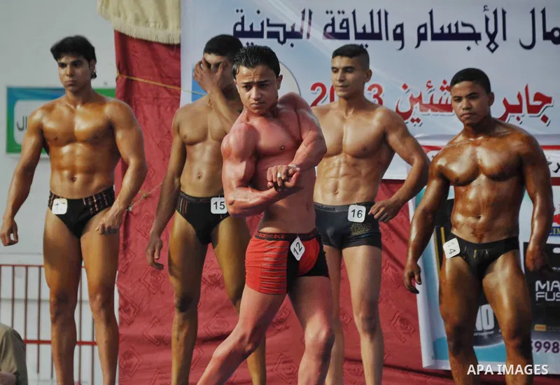 Palestinians take part in a Gaza bodybuilding championship, on May 10, 2013, in Gaza city. Photo by Mohammed Nehru