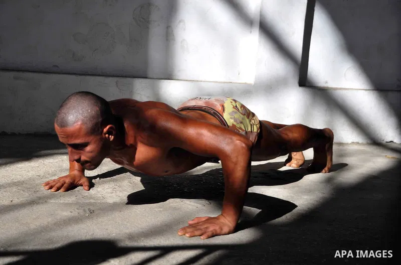 A Palestinian poses during a Gaza bodybuilding championship, on May 10, 2013, in Gaza city. Photo by Mohammed Nehru