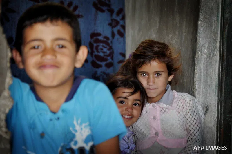 Palestinian refugee children from Farwaneh Family pose at their house in Khan Younis in southern Gaza Strip, May 14, 2013. Bassem Farwaneh is a disabled man after he was targeted by Israeli troops, sustenance to provide...