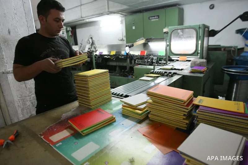 A Palestinian worker works in paper factory in the West Bank city of Hebron, on May, 18. 2013. Company industries paper is the latest in Palestine, where you export the paper for Jordan. Photo by Mamoun Wazwaz