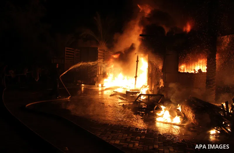 Palestinian firemen try to extinguish a fire at a livestock farm in Rafah in southern Gaza Strip on May 18, 2013. The fire sparked by electrical short circuit next to fuel barrels. Photo by Masad al-Mahmom