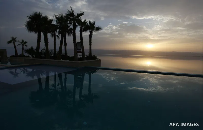 General view to the Dead Sea in the west of Jordan on May 19, 2013. The Dead Sea water is rich in minerals and mud, both useful for skin. Those who could reach the beach from Jordan, Israel and the West Bank can benefit...