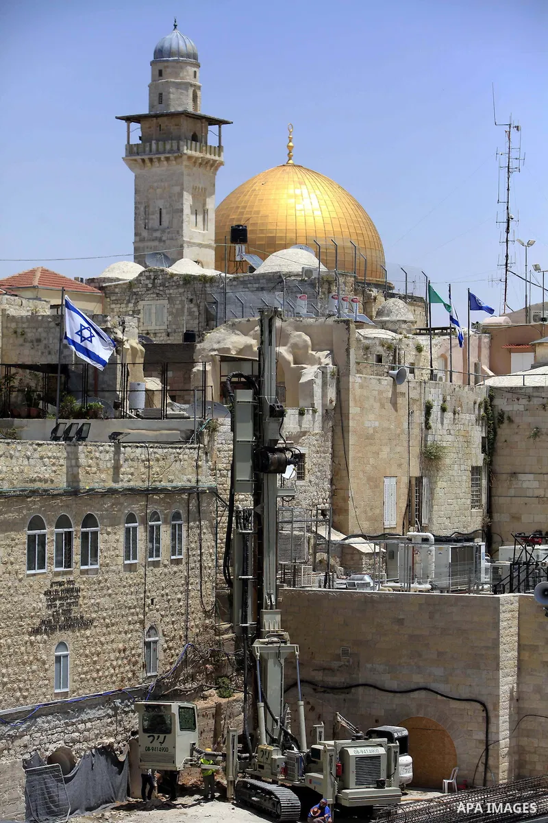 Israeli excavator diggs at the northern side of the Western Wall in Jerusalem's Old City on May 20, 2013. Israeli authority decided to build religion Jewish center in the yard which called "Beit Strauss". Photo by Sliman...