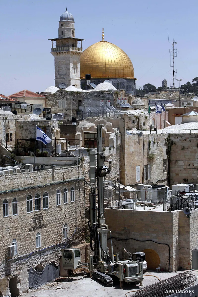 Israeli excavator diggs at the northern side of the Western Wall in Jerusalem's Old City on May 20, 2013. Israeli authority decided to build religion Jewish center in the yard which called "Beit Strauss". Photo by Sliman...