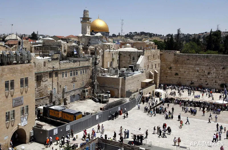 Israeli excavator diggs at the northern side of the Western Wall in Jerusalem's Old City on May 20, 2013. Israeli authority decided to build religion Jewish center in the yard which called "Beit Strauss". Photo by Sliman...