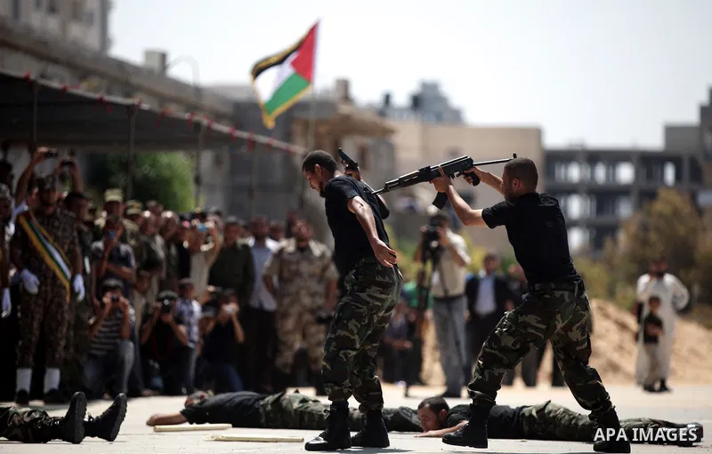 Palestinian members of national security show their skills during a graduation ceremony in Gaza City May 21, 2013. Photo by Ali Jadallah