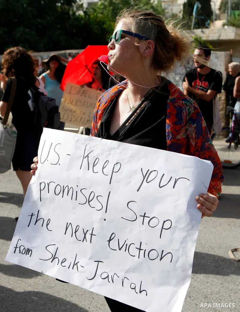 Solidarity foreigners, Palestinians and Israelis protest in solidarity with the people of the Sheikh Jarrah neighborhood during their weekly march of solidarity, in Jerusalem May 24, 2013. Photo by Sliman Khader