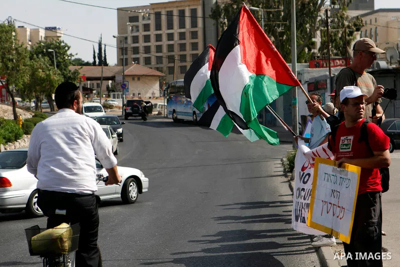 Solidarity foreigners, Palestinians and Israelis protest in solidarity with the people of the Sheikh Jarrah neighborhood during their weekly march of solidarity, in Jerusalem May 24, 2013. Photo by Sliman Khader