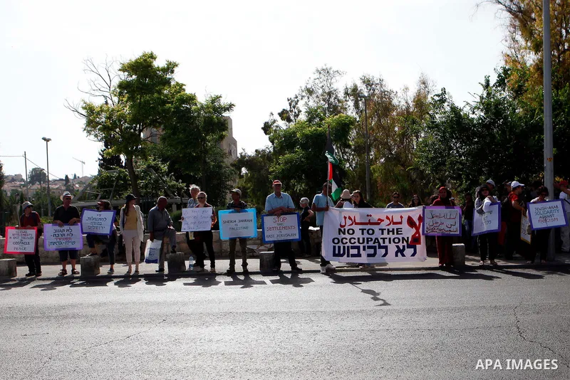 Solidarity foreigners, Palestinians and Israelis protest in solidarity with the people of the Sheikh Jarrah neighborhood during their weekly march of solidarity, in Jerusalem May 24, 2013. Photo by Sliman Khader