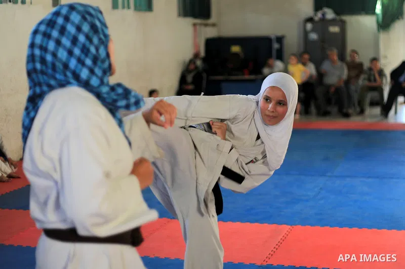 Palestinian girls take part in a karate class, which aims at teaching self-defense techniques, at Gaza's sport club in Gaza City on June 02, 2013. Photo by Yasser Qudih