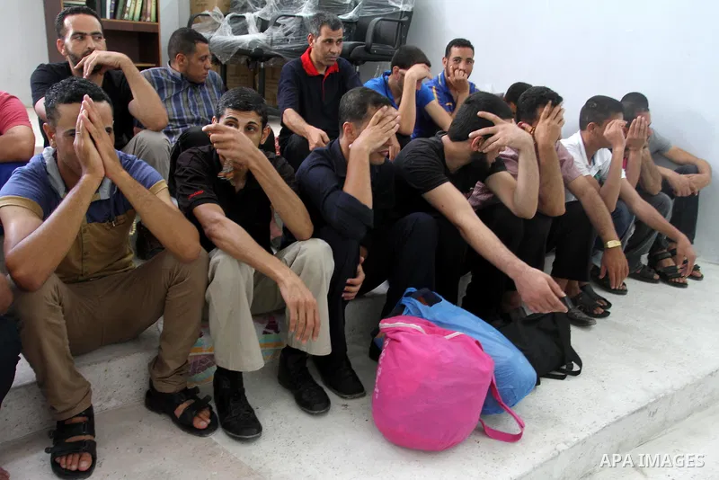 Palestinian prisoners leave the prison run by the security forces in Gaza Strip,in Gaza City on June 3, 2013. Security officials in Gaza Strip said they released 51 prisoners who spent two thirds of their sentences. Phot...