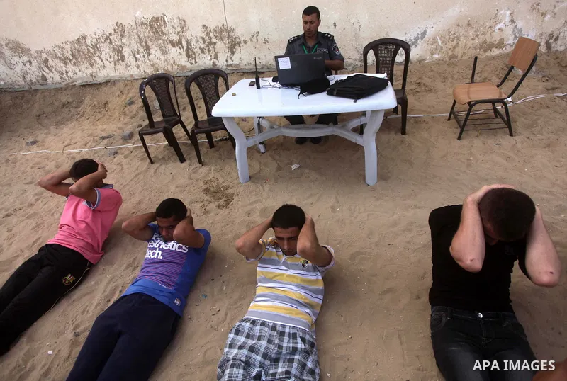 Palestinian applicants undergo a physical examination at a Palestinian recruitment centre in Gaza City June 3, 2013. 100 recruits from 14,000 applicants aged between 18 to 25 will be chosen to join the Palestinian police...