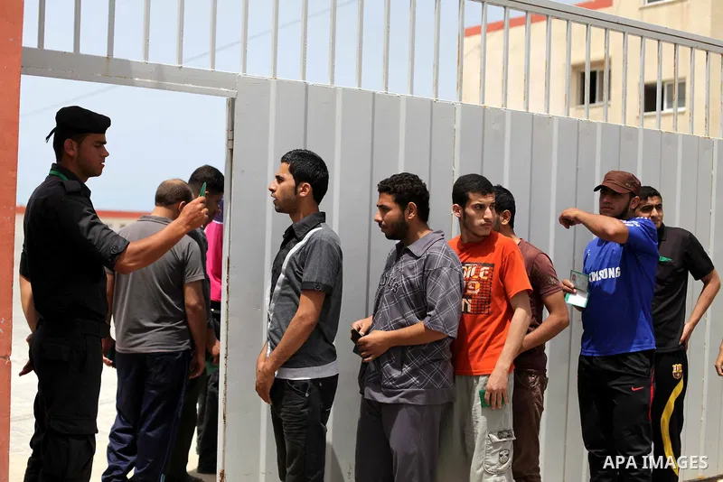Palestinian applicants arrive at a Palestinian recruitment centre in Gaza City June 3, 2013. One hundred recruits from 14,000 applicants aged between 18 to 25 will be chosen to join the Palestinian police, Palestinian of...