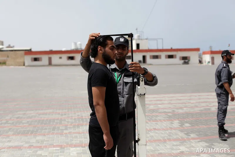 Palestinian applicants undergo a physical examination at a Palestinian recruitment centre in Gaza City June 3, 2013. 100 recruits from 14,000 applicants aged between 18 to 25 will be chosen to join the Palestinian police...