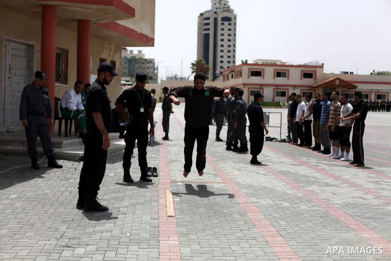 Palestinian applicants undergo a physical examination at a Palestinian recruitment centre in Gaza City June 3, 2013. 100 recruits from 14,000 applicants aged between 18 to 25 will be chosen to join the Palestinian police...