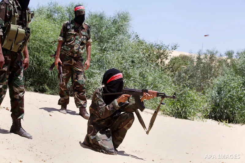 Female Palestinian militants from the Democratic Front for the Liberation of Palestine (DFLP) take part in a training session in Rafah in the southern Gaza Strip June 10, 2013. Photo by Ashraf Amra