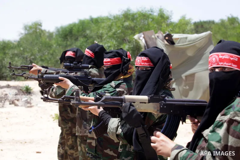 Female Palestinian militants from the Democratic Front for the Liberation of Palestine (DFLP) take part in a training session in Rafah in the southern Gaza Strip June 10, 2013. Photo by Ashraf Amra
