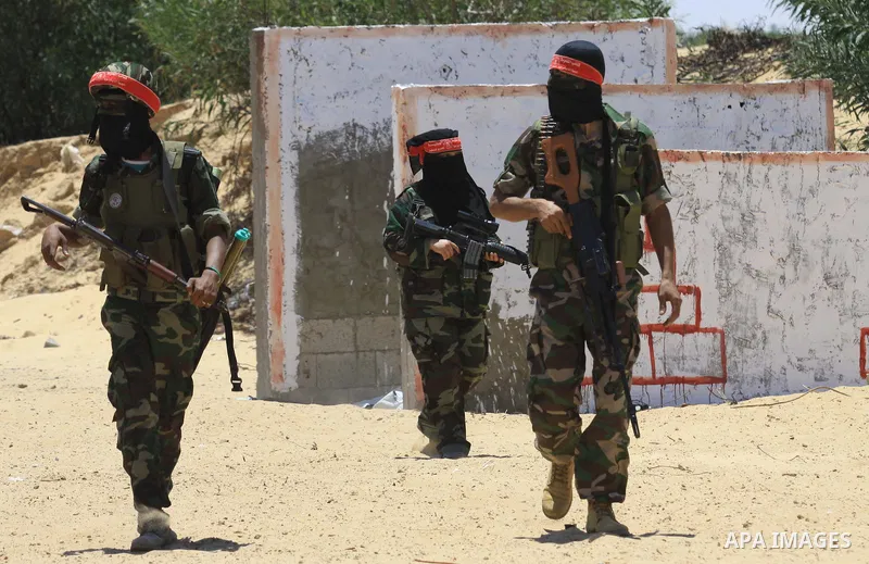 Palestinian militants from the Democratic Front for the Liberation of Palestine (DFLP) take part in a training session in Rafah in the southern Gaza Strip June 10, 2013. Photo by Ashraf Amra