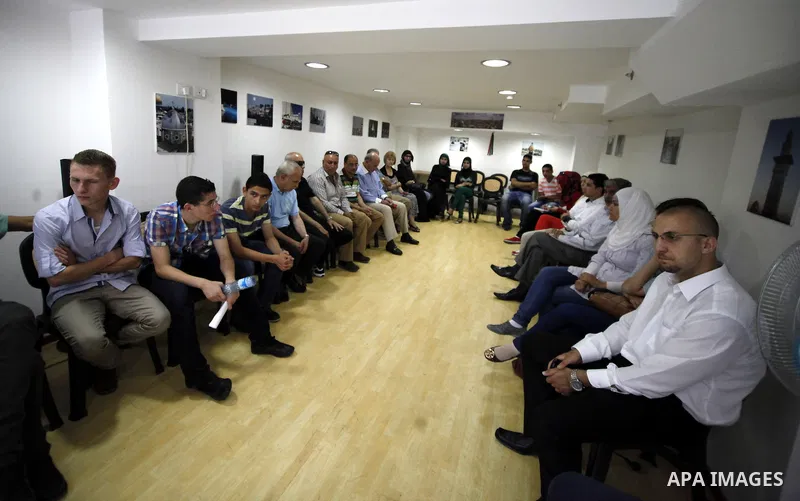 Palestinian youths attend a symposium headed by Palestine Development and Investment (PADICO) Chairman Munib al-Masri, talks about the latest implications of the visit of U.S. Secretary of State John Kerry to the Palesti...