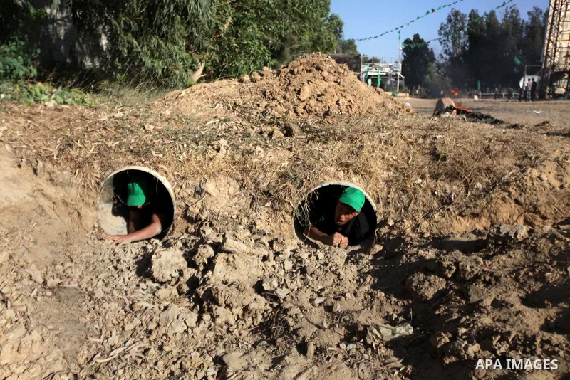 Young Palestinians take part in a military-style exercise run by Hamas during summer vacation in Gaza City June 10, 2013. Photo by Ashraf Amra