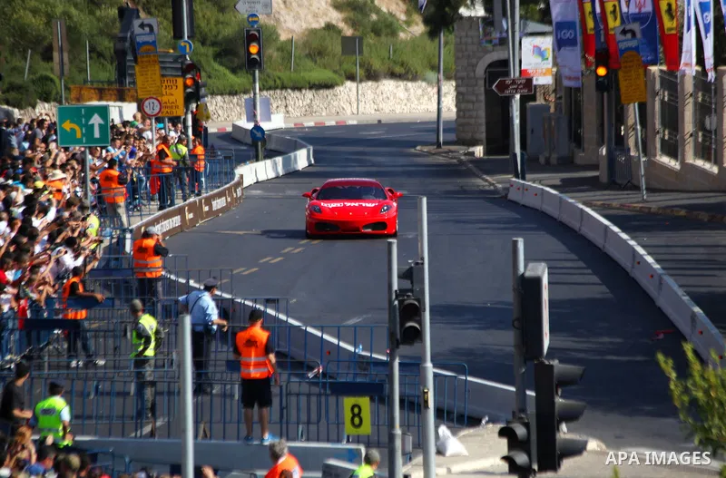 A Formula One racing car is driven during the race of the 'Peace Road Show' in Jerusalem's old city on June 13, 2013. Jerusalem's Sports Federations Group asserted that the race in Jerusalem with the participation of the...