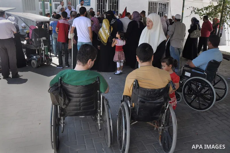 Palestinians from the General Union of Disabled take part a protest in front of the headquarters of the Ministry of Labour to demand their employment, in Gaza city on June 16, 2013. Photo by Mohammed Talatene