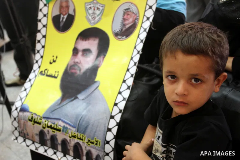 Families of Palestinian prisoners participate in a seminar in solidarity with the martyrs of the revolution Buraq to mark the 83th anniversary of the execution of prisoners of Akka jail by the the British army in Qalaa j...