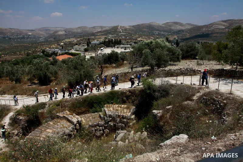 Israelis visit the Roman basilica and forum in the village of Sebastia near the West Bank city of Nablus, on June 17, 2013. The ancient town of Sebastia is one of the greatest archaeological sites of the Holy Land, attra...