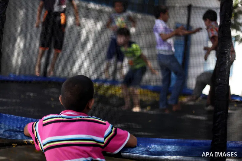 Palestinian boys play at a summer camp organised by UNRWA for students of UNRWA schools in Gaza City on June 18, 2013. Photo by Ashraf Amra