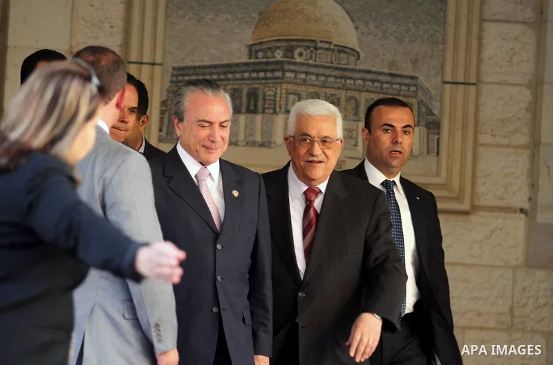 Palestinian President Mahmoud Abbas and the Brazilian Vice President Michel Temer, leave following their meeting, in the West Bank city of Ramallah, June 19, 2013. Photo by Issam Rimawi