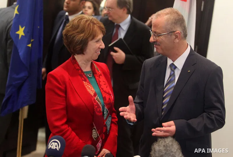 Palestinian Prime Minister Rami Hamdallah meets with European Union foreign policy chief Catherine Ashton during their joint news conference after their meeting in the West Bank city of Ramallah June 19, 2013. Photo by I...