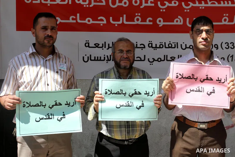 palestinians take part a protest to demand their right to pray in Jerusalem, in Gaza city, on June 20, 2013. Photo by Mohammed Asad